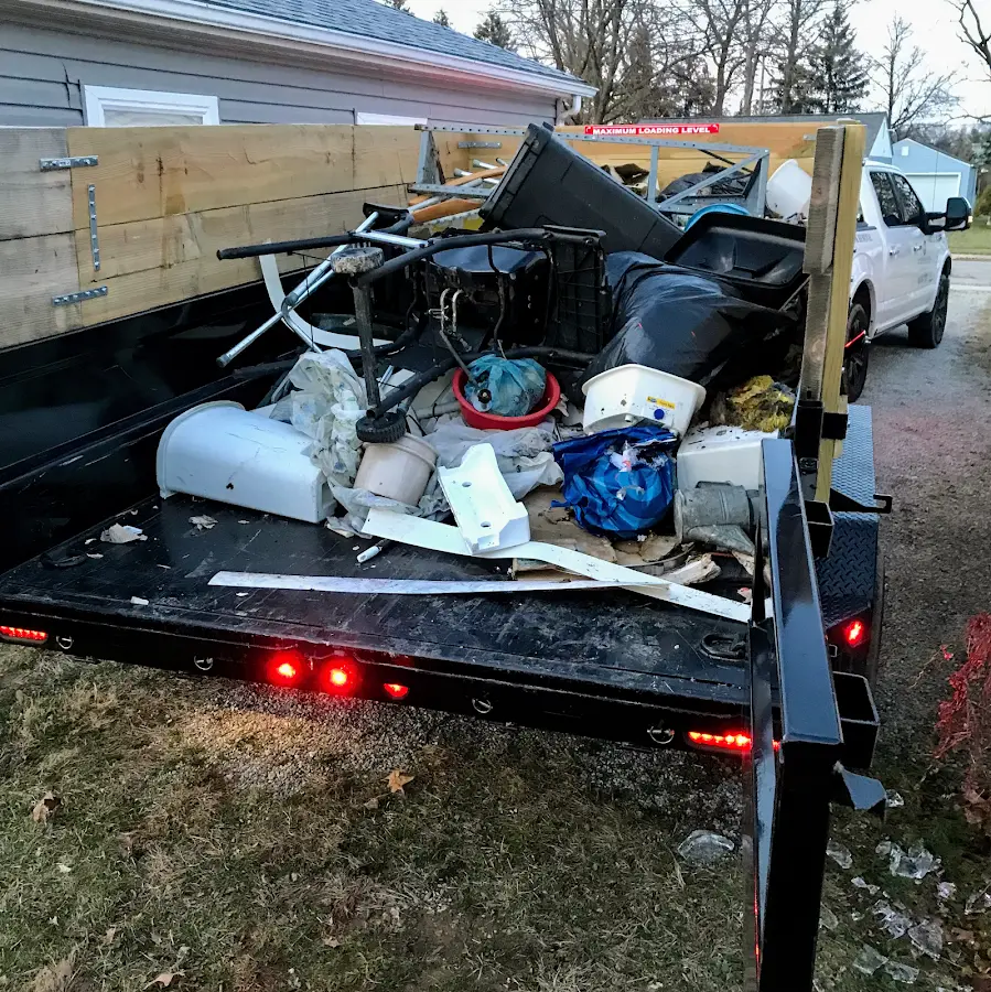 Roll-off dumpster delivered to a residential driveway in Rogersville